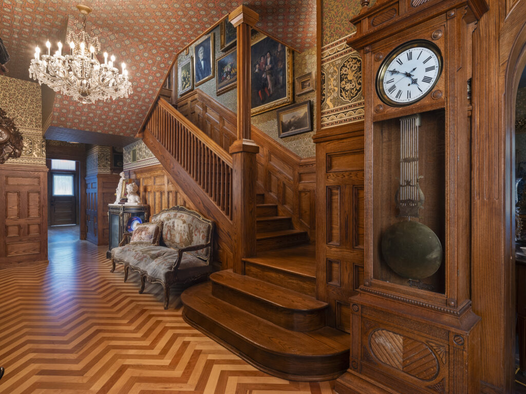 Schifferdecker foyer with chandelier, staircase and grandfather clock