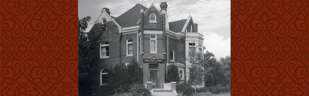 Black and white photo of Zelleken home with sign over the front door "Spiva Art Center"