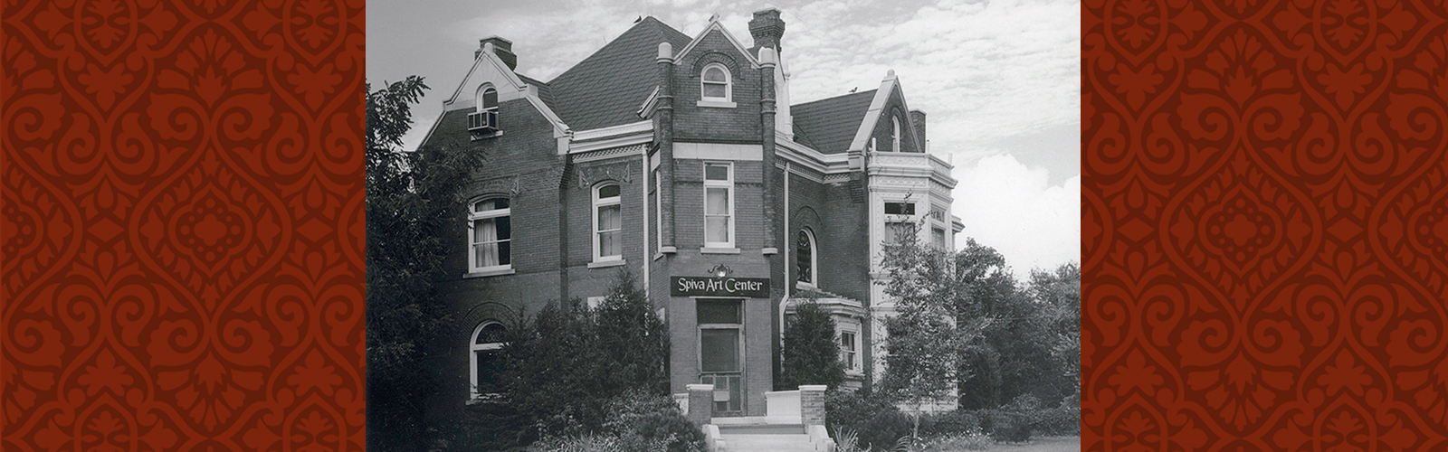 Black and white photo of Zelleken home with sign over the front door "Spiva Art Center"