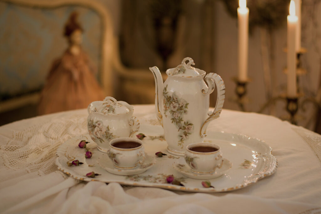 Antique tea set on a table with a white tablecloth